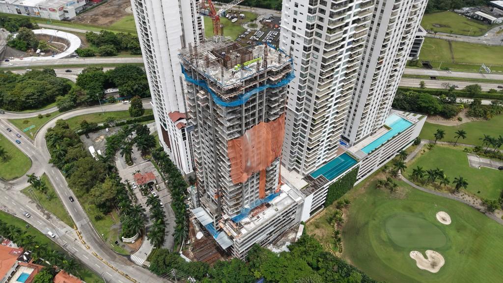 Aerial view of a residential tower under construction in Panama City, the type of first sale property that qualifies at $300,000 USD under Executive Decree 17